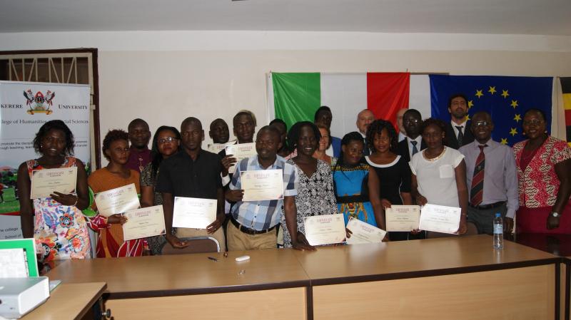 Students pose for a photo after receiving certificates of participation in courses taught by the University of Turin Professors