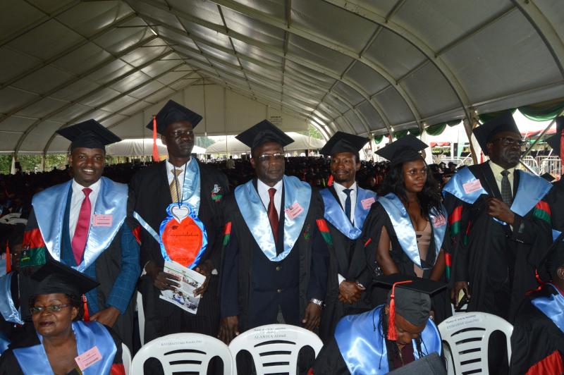 Justice Kavuma (3rd left) graduated with an MA in International Relations and Diplomatic Studies