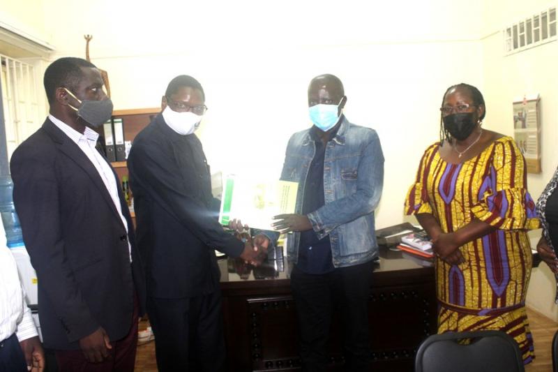 The outgoing Head, Dr Okot Benge (2nd L) handing over to Dr Nabutanyi (2nd right). On the right is the Principal, Dr Josephine Ahikire and on the left is the Acting Deputy Principal, Dr Julius Kikooma