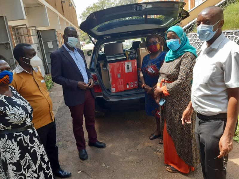 Staff from the Department of European and Oriental Languages led by the Head, Dr Edith Natukunda - Togboa (3rd R) receiving online training equipment from the French Embassy FSPI Project. The handover event was witnessed by the Principal, Dr Josephine Ahikire; Ag. Deputy Principal of CHUSS, Dr Julius Kikooma (3rd L); and the Dean,  School of Languages, Literature & Communication, Dr Saudah Namyalo (2nd R)