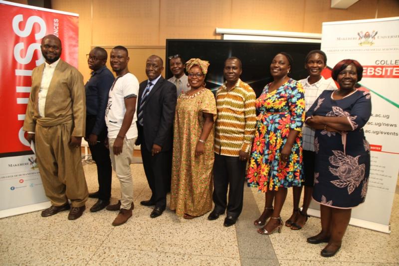 The researchers, Dr William Wagaba (4th L), Dr Stevens Odongoh (3rd L), Dr Enoch Sebuyungo (4th R) and Ms Margaret Nanfuka Mbalule (3rd R) with the Head, Department of European and Oriental Languages, Dr Edith Natukunda - Togboa (C) and other members of staff at the seminar