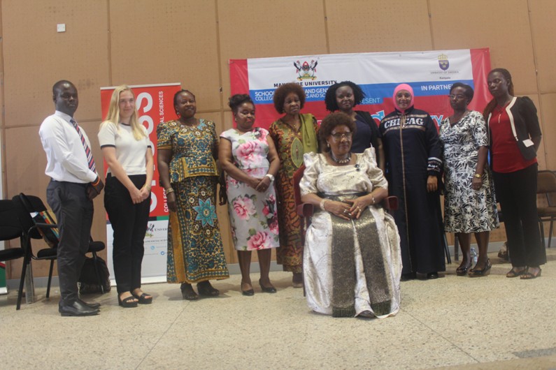 The Namasole with the panelists namely; Ms. Joanita Kawalya (4th L), Mrs. Elizabeth Lwanga (5th L), Ms. Despina Namwembe (4th R), Mrs Tugulwa (3rd R), Mrs Sseggujja (2nd R), Ms. Nakizito (R) as well as representatives from the Swedish Embassy and Dr Florence Ebila 