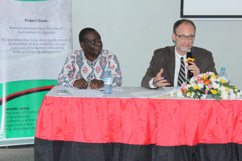 Prof. Peterson (R) delivers his presentation. On the left is the discussant, Mr. Mwambustya Ndebesa