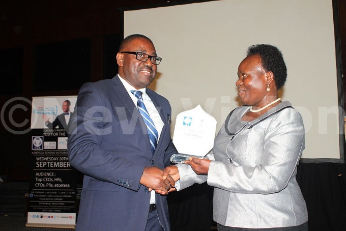 Executive Director of Uganda Wildlife Authority Andrew Seguya receiving the Most Benevolent CEO of the year award 