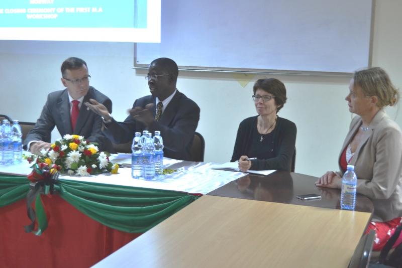 Prof Kirumira addresses participants. Looking on is the Prof. Dag Rune Olsen, the Vice Rector for International Affairs, Prof Anne Christine Johannesen, and the Advisor, Graduate Programme/Joint Degrees at UiB, Ms Anne Beate Maurseth