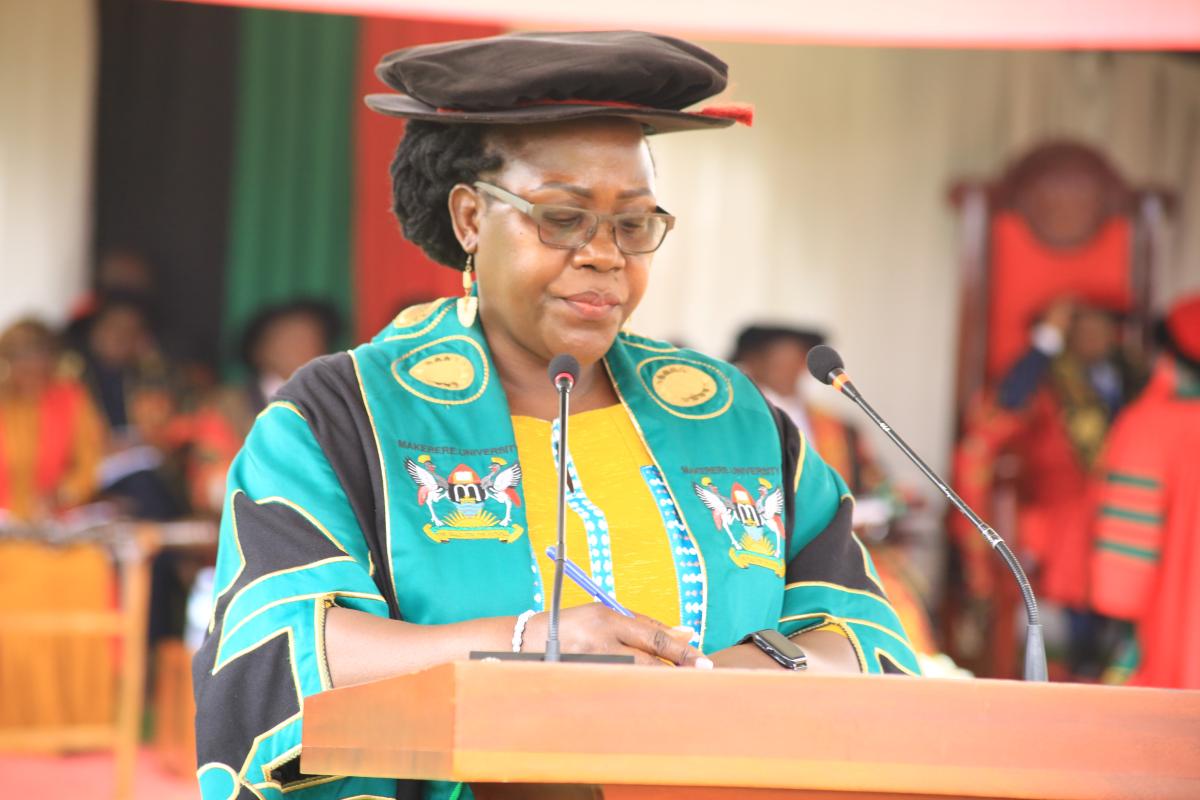 The Principal CHUSS, Dr. Josephine Ahikire reading out names of the PhD Graduands 