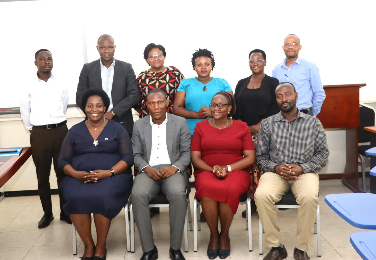 Attendees in a group photo after the handover ceremony