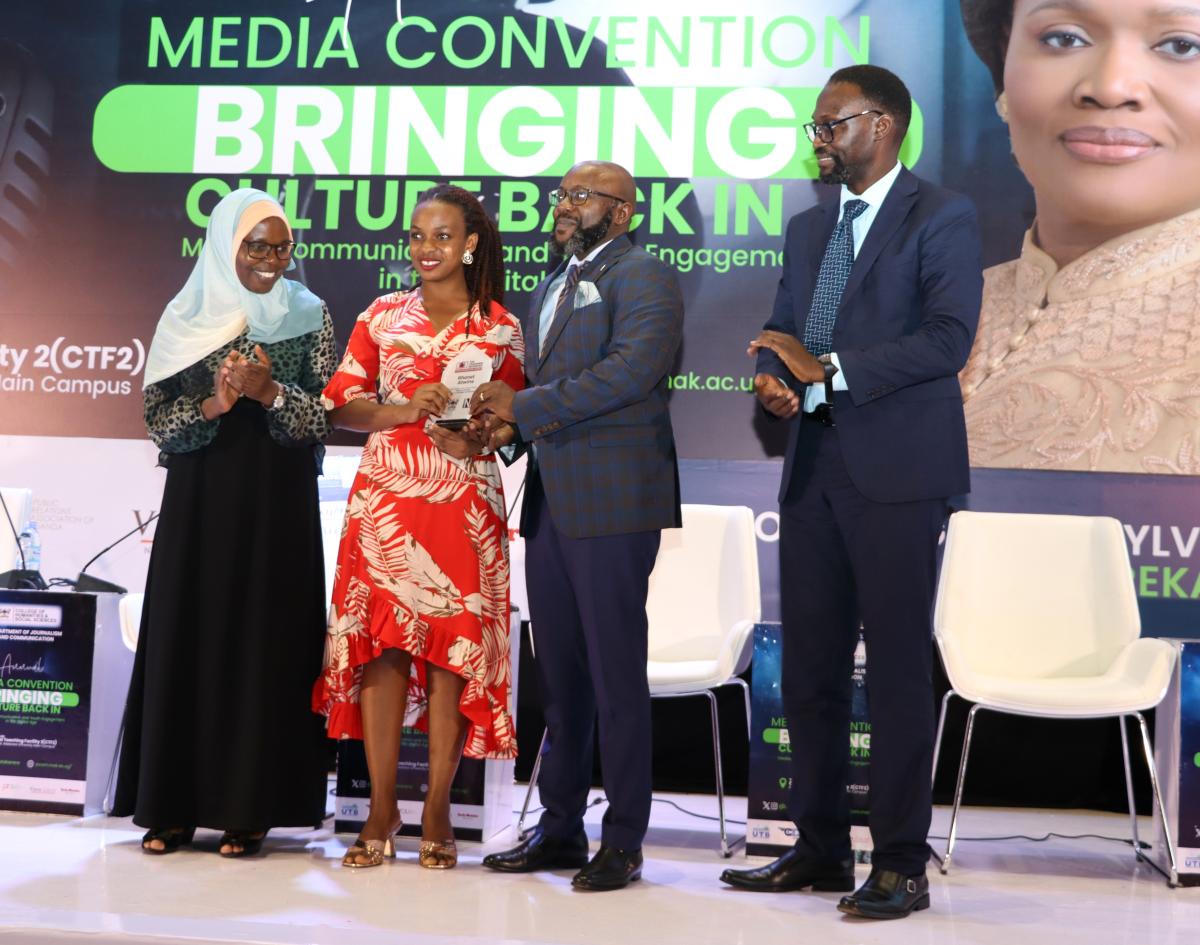 Atwine Rhonet receives the Cranimer Mugerwa Award from the New Vision CEO Don Wanyama
