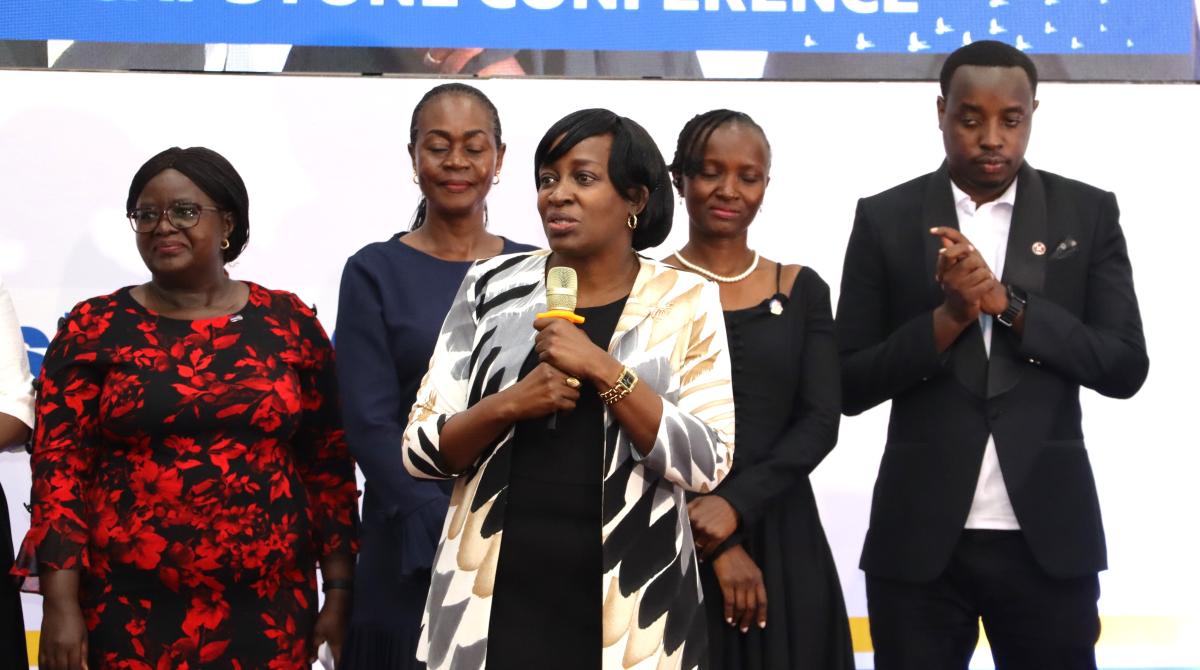 District Governor Anne Nkutu( holding mic) flanked by rotarians