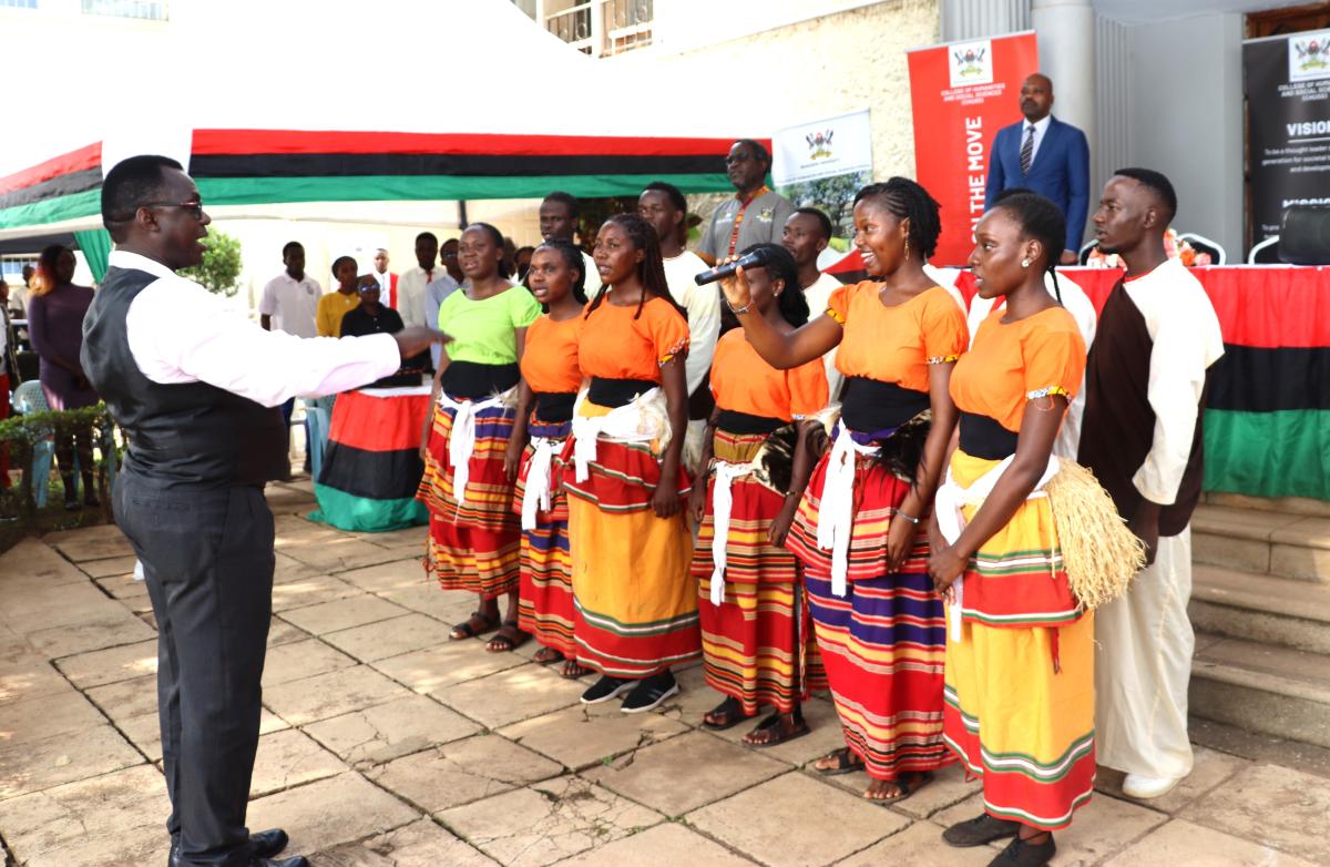 Dr. Benon Kigozi and students from Performing Arts and Film siging the National Anthems