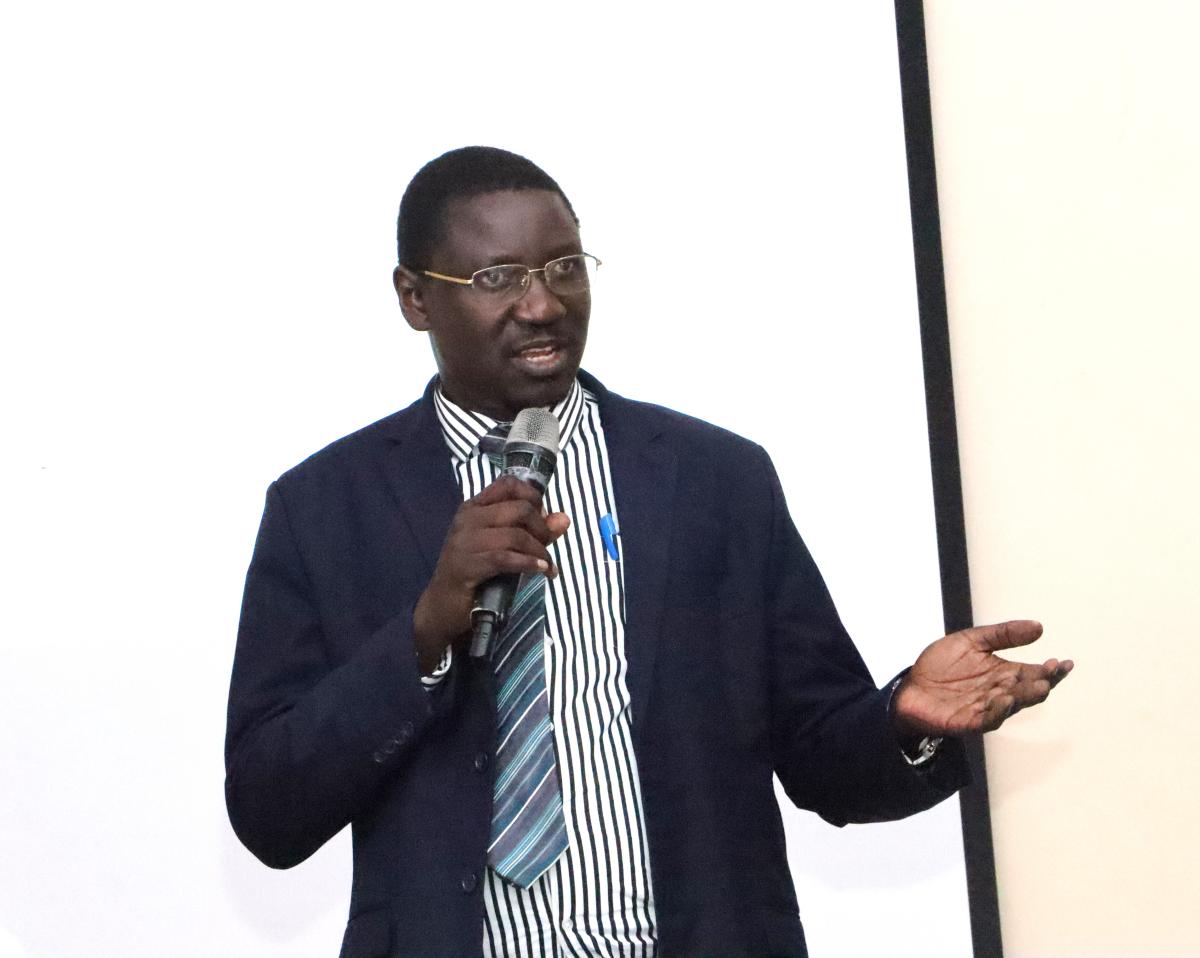 Dr. Cyprian Misinde addressing staff on the e-timet table and the biometric system