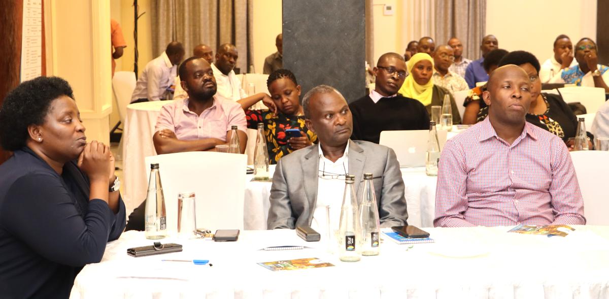 Prof. Helen Nkabala and some staff listening to Mr Yusuf Kiranda