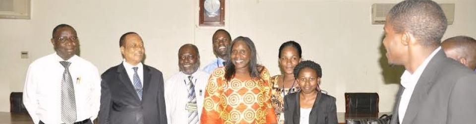 The organizers of the Uongozi Summer School 2014 chat with former Prime Minister of Uganda, Prof. Apollo Nsibambi.