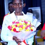 Dr Suzan Kiguli after receiving a bouquet of flowers