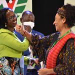  Mrs. Lorna Magara interacts with Prof. Amina Mama after the opening ceremony