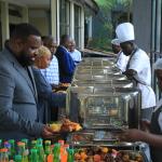 Participants at the dinner service point