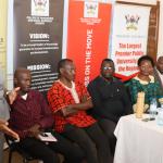 Prof. Nkabala flanked by staff speaking to students during the meeting