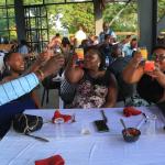 Staff and program beneficiaries tosting the drinks during the dinner