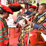 The Chancellor Prof. Ezra Suruma Confers a PhD graduand