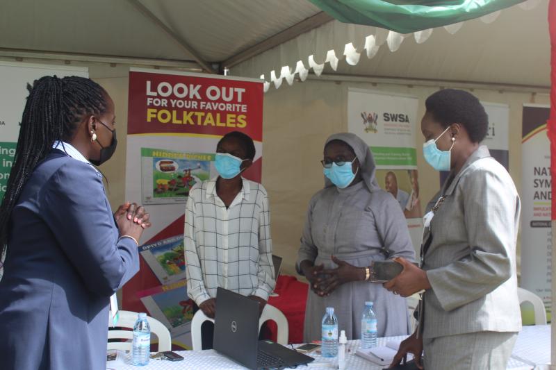 Officials from Mak-RIF, Ms. Phoebe Kamya Lutaaya (R) and Ms. Harriet Adong (L) engaging some of the researchers